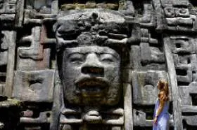 Art History senior Sofia Yazpik gazes at a monumental Maya lord at Lamanai. Sofia Yazpik gazes at a monumental Maya lord at Lamanai