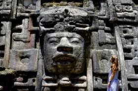 Art History senior Sofia Yazpik gazes at a monumental Maya lord at Lamanai. Sofia Yazpik gazes at a monumental Maya lord at Lamanai